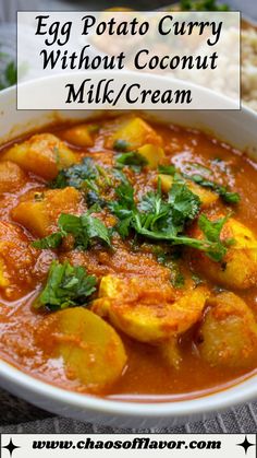 egg potato curry without coconut milk / cream in a white bowl with text overlay