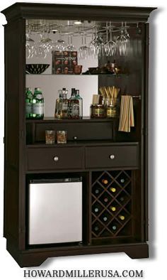 a wooden cabinet with wine glasses and bottles