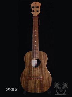 the ukulele is made out of wood and has an unusual design on it