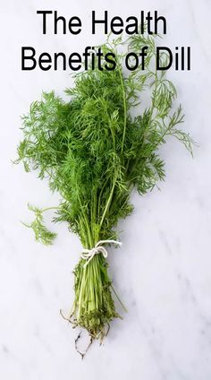 the health benefits of dill on a white marble countertop with text overlay that reads, the health benefits of dill