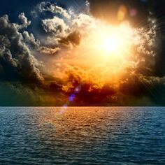 the sun is shining brightly in the sky over the ocean with dark clouds and bright blue water