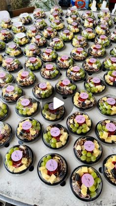 a table topped with lots of small plates filled with different types of food on top of it