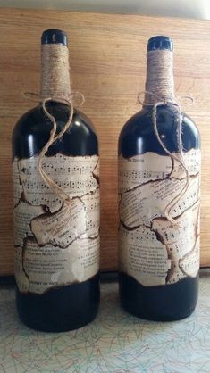 two wine bottles with music notes on them