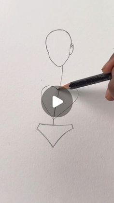 someone is drawing a man's head with a pencil