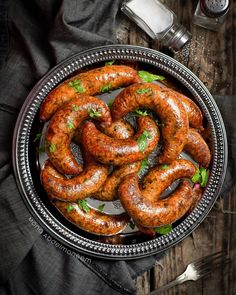 some sausages are in a bowl on a table