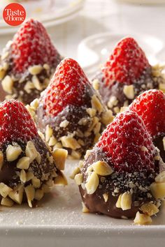 chocolate covered strawberries and nuts on a plate