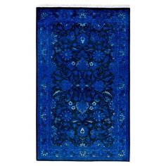 a blue rug with an intricate design on the front and back side, in various colors