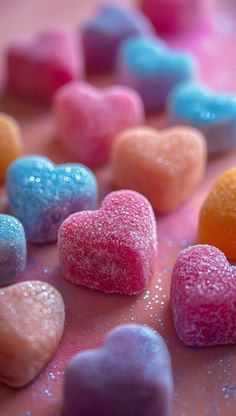 heart shaped candy candies on a pink surface