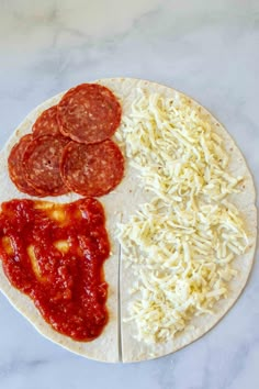 a pizza with cheese, pepperoni and sauce on it next to a fork that is resting on the tortilla