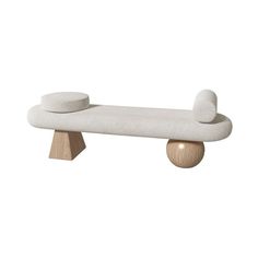 a white bench with two round cushions on it's legs and one foot in the middle