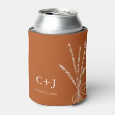 a can cooler with the initials c + j and an image of flowers on it