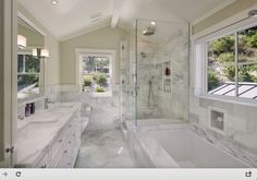 a large bathroom with two sinks and a bathtub