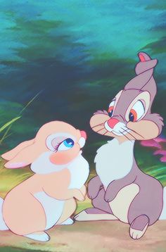 two cartoon rabbits sitting next to each other