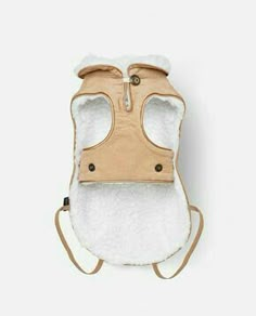 a baby carrier with a hood on it's back and the front flap open