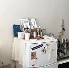 a white refrigerator freezer sitting inside of a kitchen