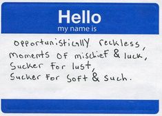 a blue and white name tag with writing on it