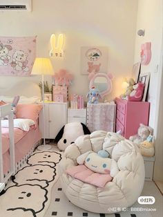 a room with two beds and stuffed animals on the floor