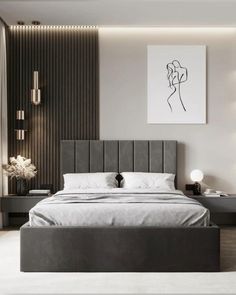 a bedroom with a bed, nightstands and artwork on the wall above it in black and white