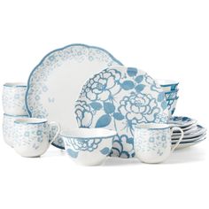 a blue and white dinner set with flowers on it