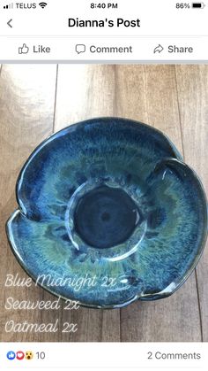 a blue bowl sitting on top of a wooden table