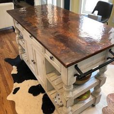 a kitchen island made out of an old cabinet and some wood on the counter top