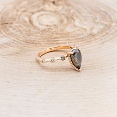 a close up of a ring on a wooden surface