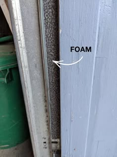 the bottom half of a door with foam on it and an arrow pointing up at the bottom