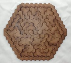 a circular wooden object with hexagonal shapes on it