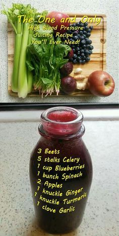 a jar filled with fruit and vegetables next to a cutting board