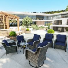 an outdoor patio with chairs and tables