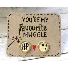 pair of harry potter inspired earrings with you're my favorite muggle written on them