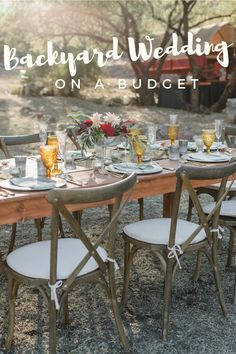 a table set up for an outdoor wedding with flowers on it and the words backyard wedding on a budget