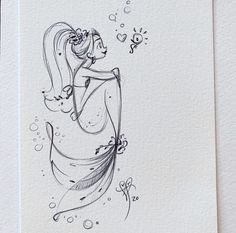 a drawing of a woman with long hair and flowers on her head is shown in black ink