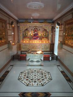 the interior of a temple with an altar and candles