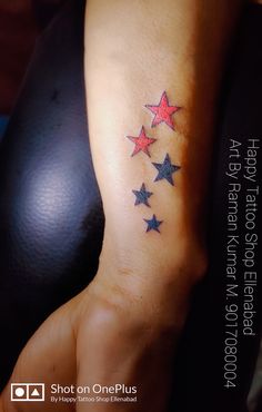 a woman's arm with five stars on it