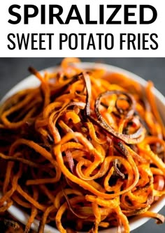 sweet potato fries on a white plate with text overlay that reads spiralized sweet potato fries