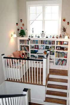 there is a bookshelf and stairs in the room