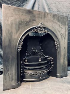 an antique fireplace with ornate carvings on it