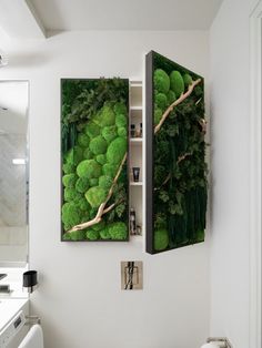 a bathroom with two open doors that have moss growing on them