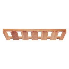 a wooden shelf that has several pieces of wood on it and is attached to the wall