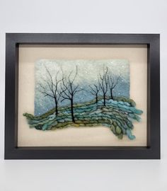 a painting with trees on it in a frame