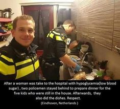 two men in yellow vests standing next to each other near a counter top with food on it