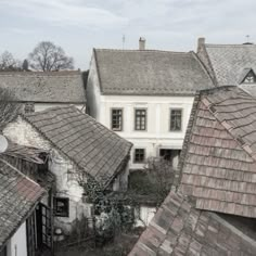 an aerial view of rooftops and buildings in the city