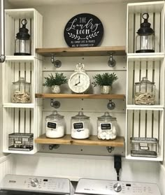 a washer and dryer in a room with shelves on the wall above them