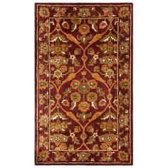 a red rug with an ornate design on the bottom and sides, in various colors