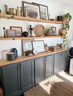 a living room filled with lots of furniture and shelves covered in pictures on top of them