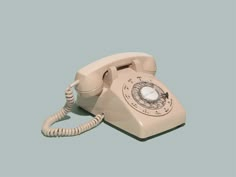 an old - fashioned telephone on a blue background