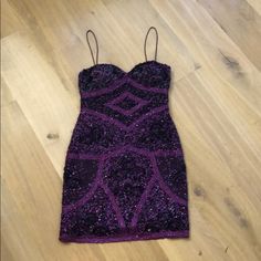 a purple dress is laying on the floor