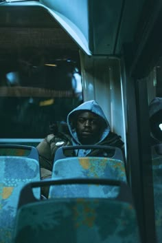 a man sitting in the middle of a bus