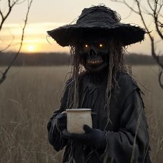 a creepy scarecrow holding a cup in the middle of a field at sunset with his eyes glowing